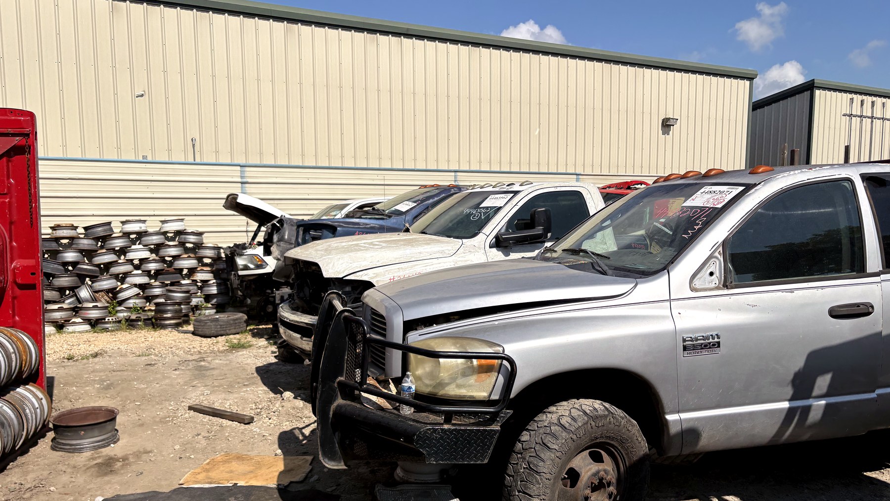 Dodge diesel trucks and used wheels in the NEXT Auto Parts yard