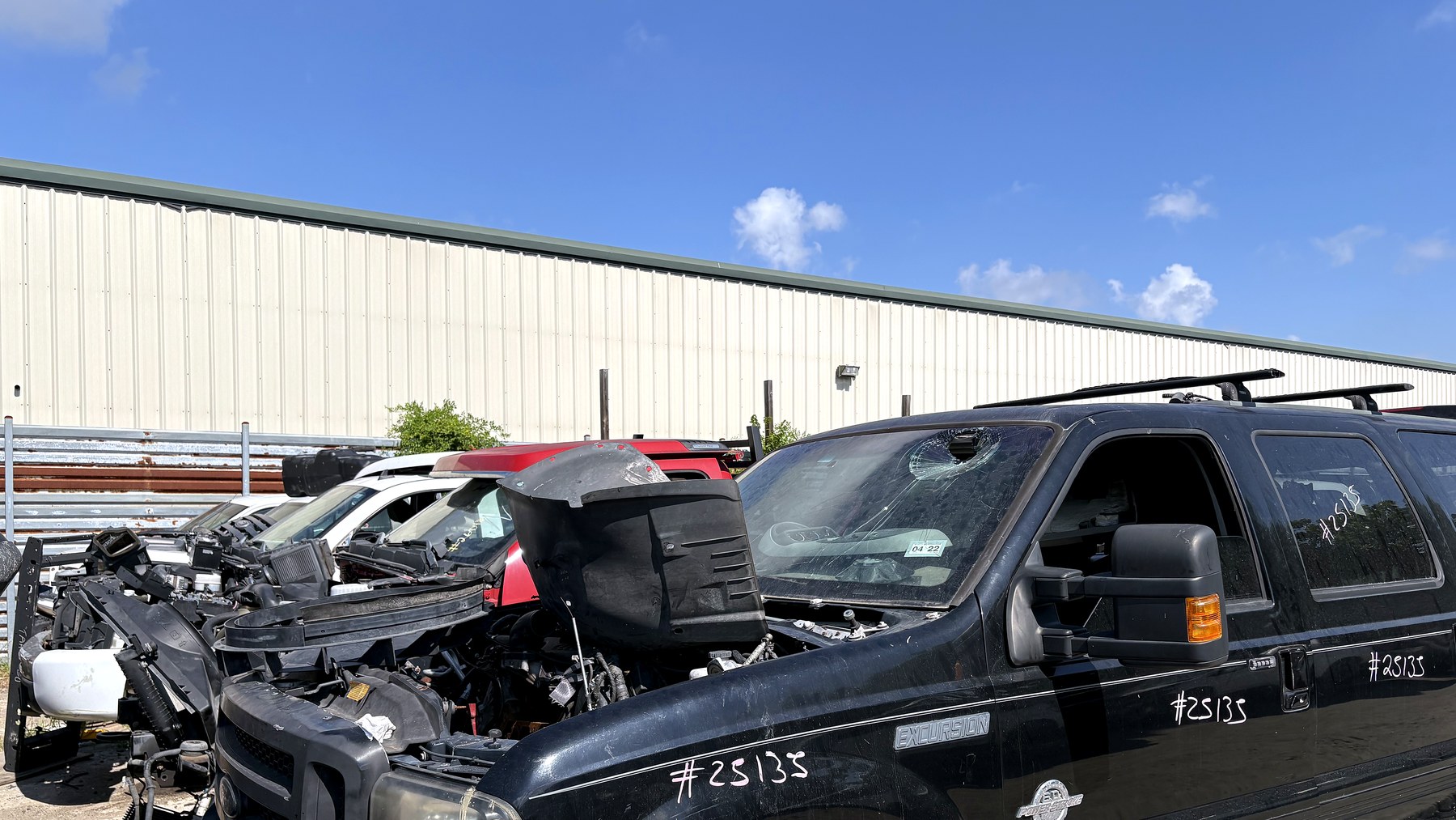 Front of a Dodge diesel truck in a used auto parts yard